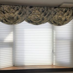 Swag & jabot valance over sheer shades in Chester Springs home.