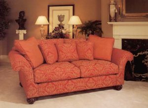Brocade covered sofa and contrast pillows.